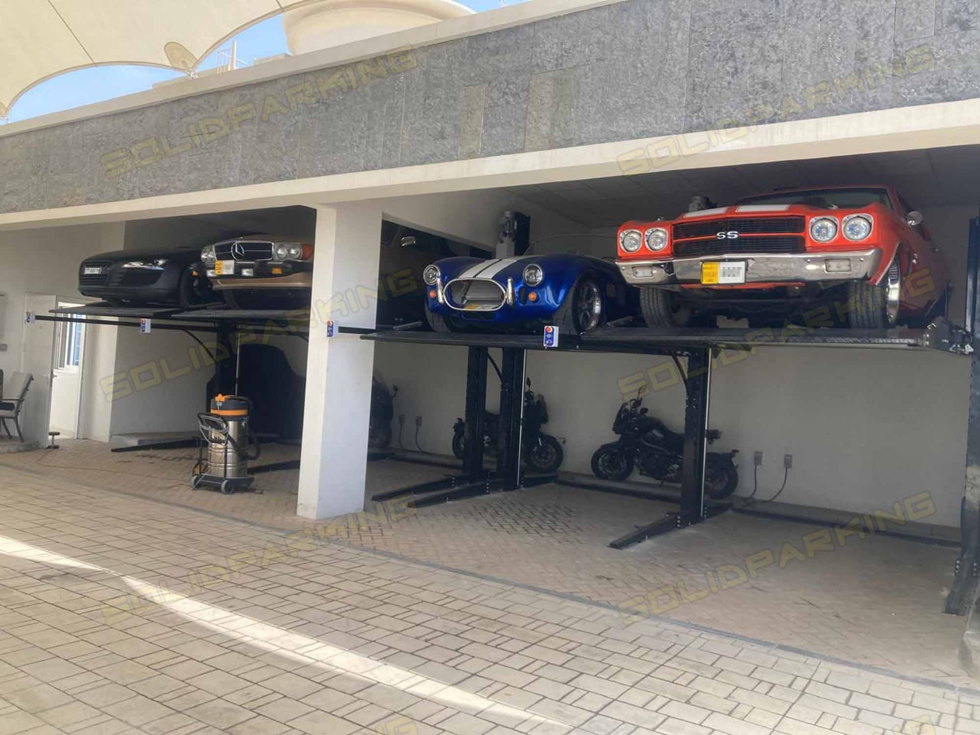 Residential 2 Post Car Lift installed in luxury home garage Residential 2 Post Car Lift: TP-320 vs TP-270 vs TP-270H vs TP-230H — The Ultimate Shared Post Parking Lift Buyer's Guide for 2026